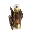 Dehn-Al-Oud-Qadeem-perfume-bottle-surrounded-by-oud-wood-against-white-background