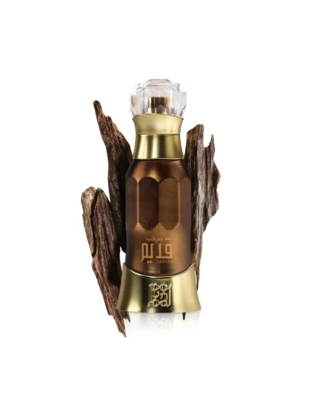 Dehn-Al-Oud-Qadeem-perfume-bottle-surrounded-by-oud-wood-against-white-background